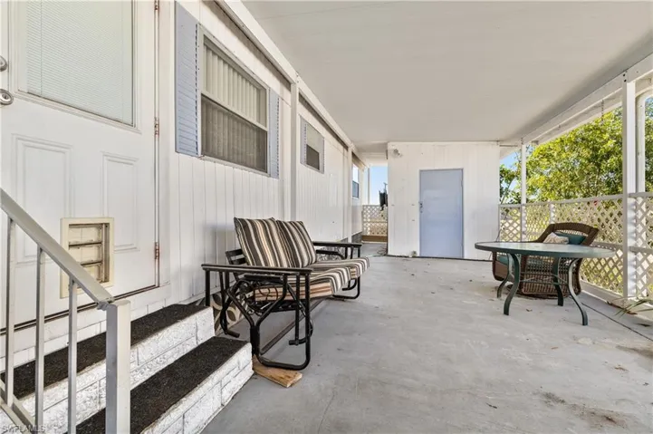 View of patio with outdoor dining area
