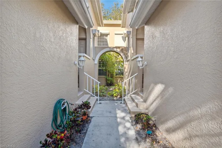 View of exterior entry with stucco siding
