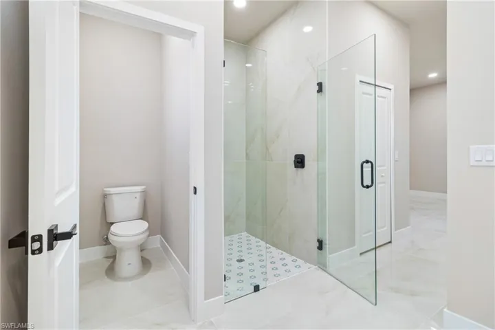 Full bath featuring a stall shower and recessed lighting