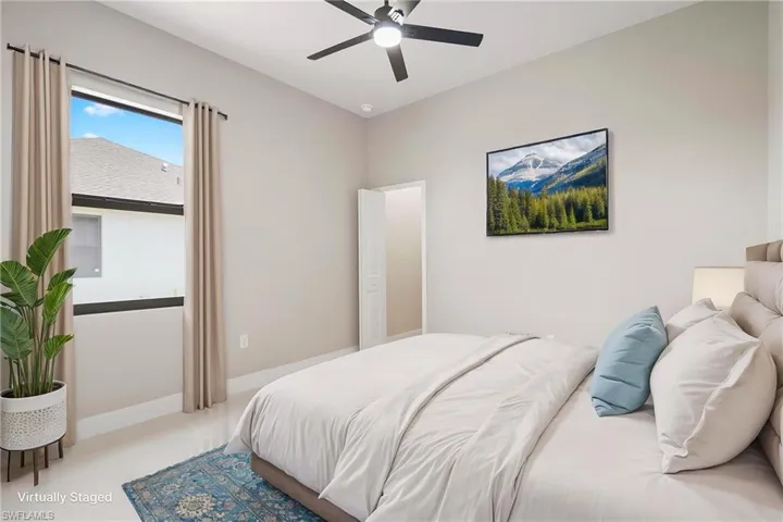 Bedroom featuring baseboards and a ceiling fan
