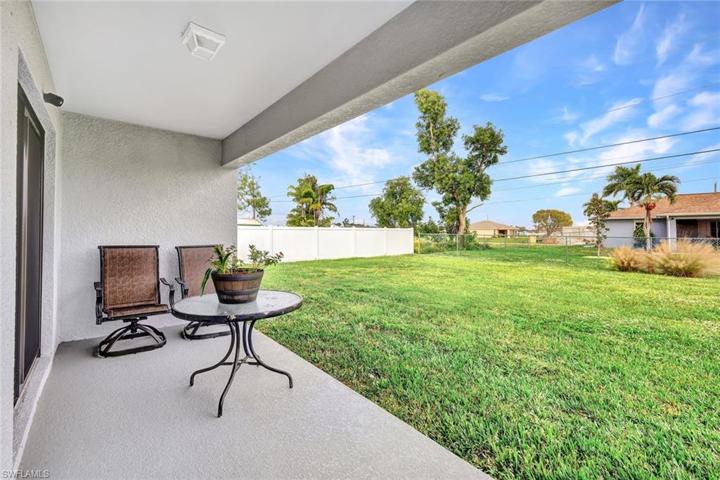 Extras & Upgrades include storm shutters and storm-rated garage door; gutters; auto-irrigation; freshly-painted exterior.