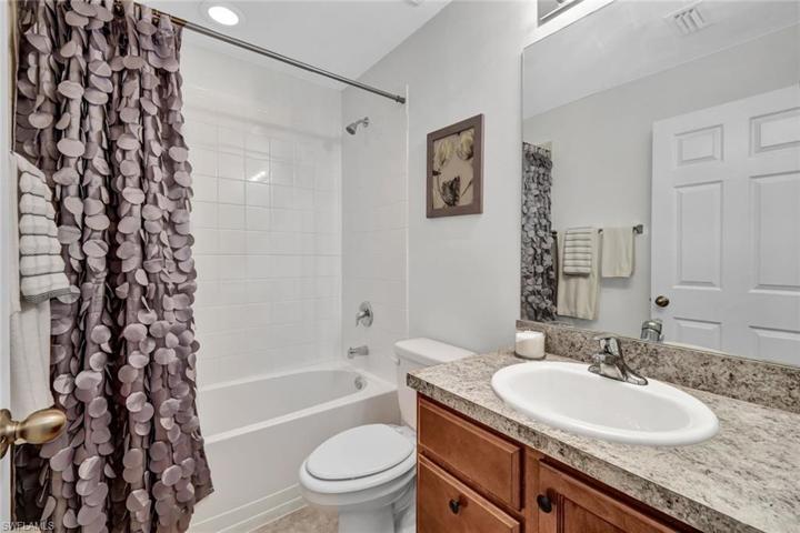 Guest bath with tub/shower combination.