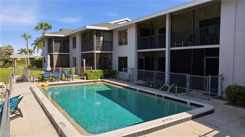 Rectangular swimming pool with integrated steps and a surrounding paved deck