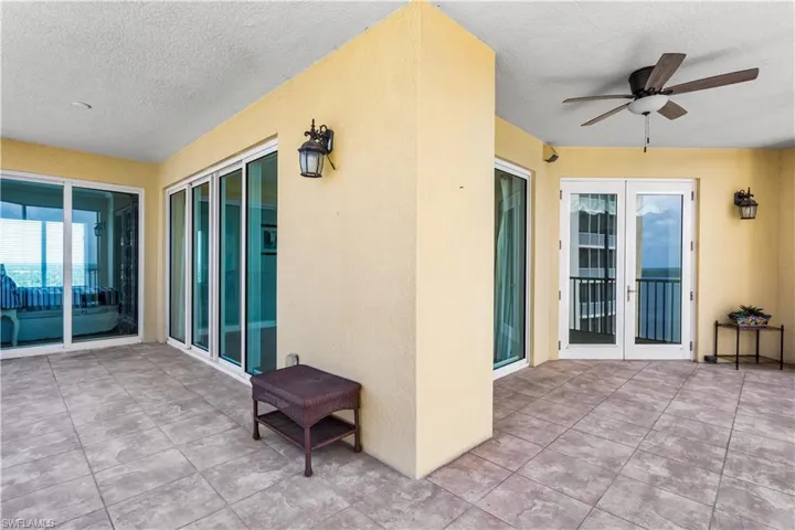 Spacious wrap-around screened balcony offering stunning north views of the Caloosahatchee River and east views of the city, St. Tropez tower & Billy Creek.