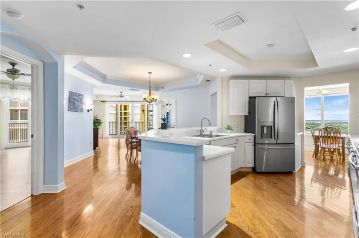 Enter this beautiful end-unit condo from either your private or the community elevator into a spacious foyer that opens into the atrium. The condo boasts 1,663 sq. ft. of living space with wood or tile flooring throughout, featuring 3 bedrooms and 2 bathrooms.