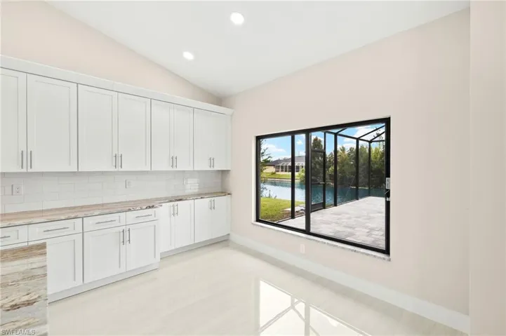 Dining area with view of pool.