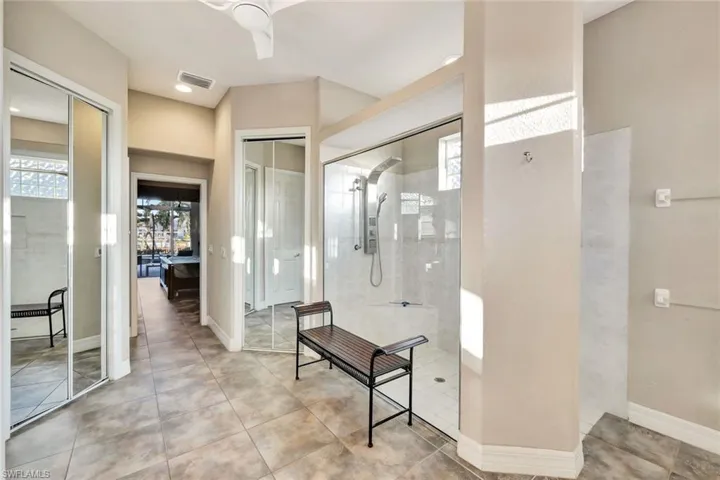 Bathroom featuring a tile shower