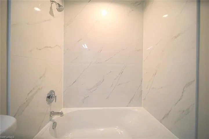 Tiled Tub Area In Master Bathroom