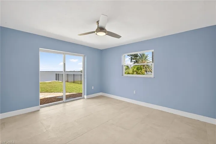 Bedroom #2 featuring light blue walls, ceramic tile flooring, and a contemporary ceiling fan