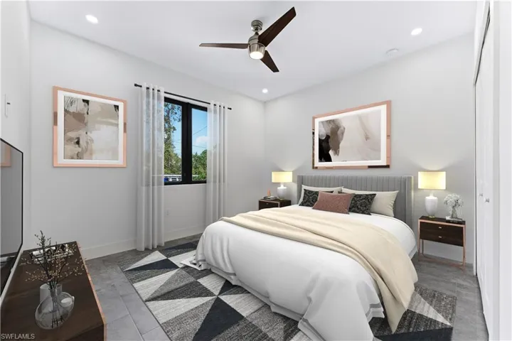 Bedroom with dark wood-type flooring, a closet, and ceiling fan photo enhanced with virtual staging.