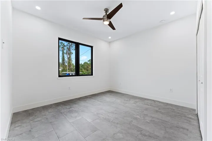 Unfurnished bedroom with ceiling fan