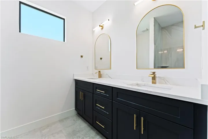 Bathroom featuring double vanity
