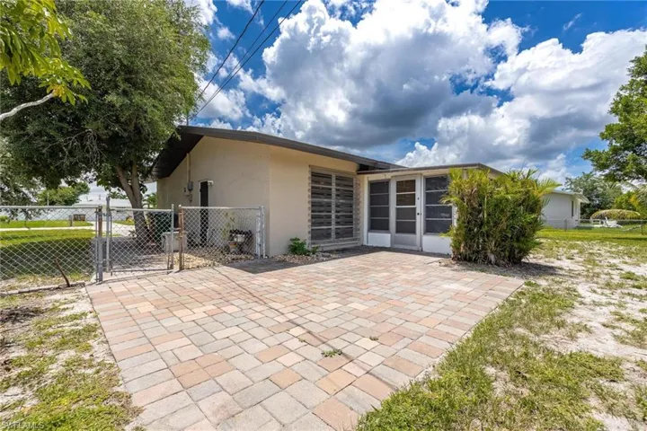 Back of property with a patio area