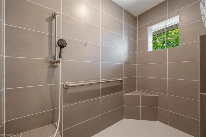 Bathroom featuring tiled shower ADA Accessible