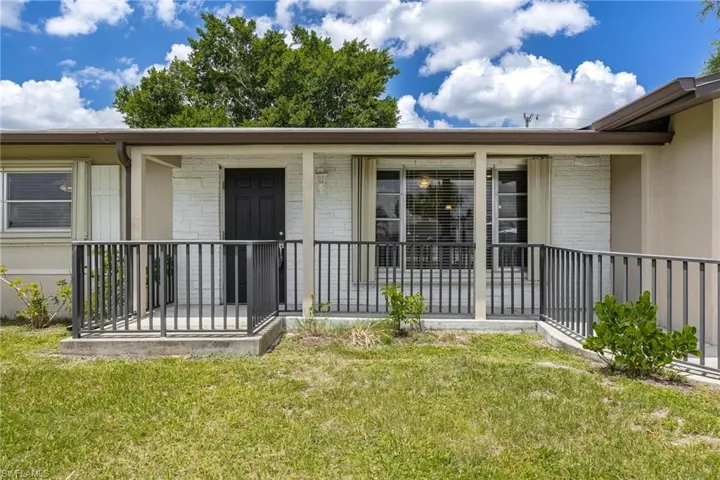 Front entrance to home with porch and ADA Ramp