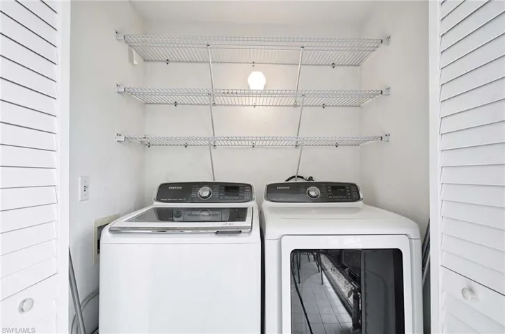 Laundry area with full sized washer and dryer