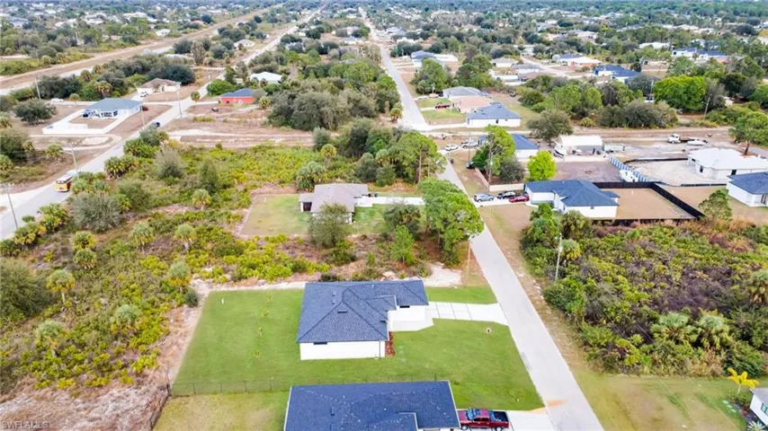 Aerial overview of property's location with nearby suburban area