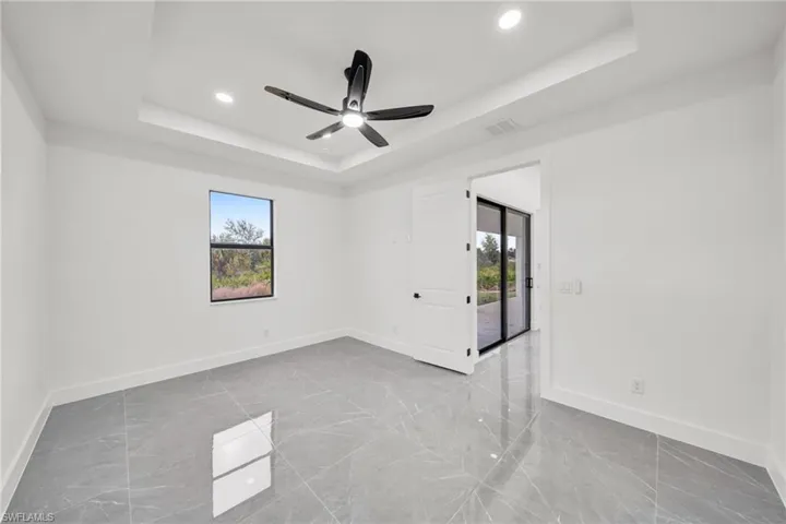 Unfurnished room with recessed lighting and a ceiling fan