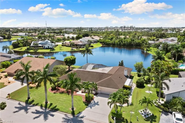 Aerial perspective of suburban area with a large body of water