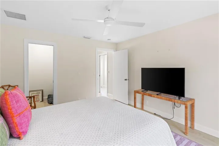 Bedroom with a ceiling fan and light wood finished floors
