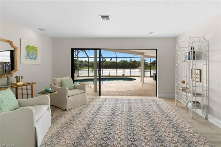 Living area featuring a sunroom and light wood finished floors