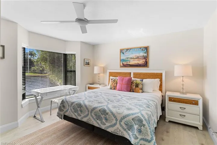 Bedroom featuring light wood-type flooring and a ceiling fan