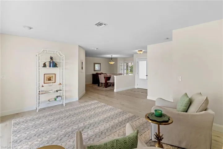 Living room featuring baseboards and light wood finished floors