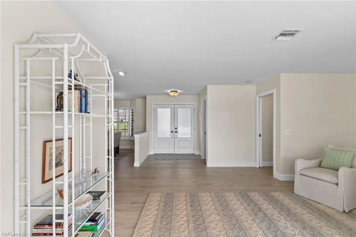 Entryway with light wood-type flooring and baseboards