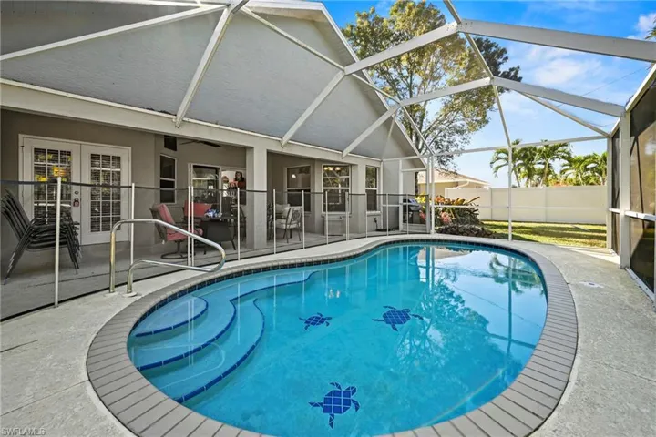 View of swimming pool with a patio, a sunroom, glass enclosure, and french doors