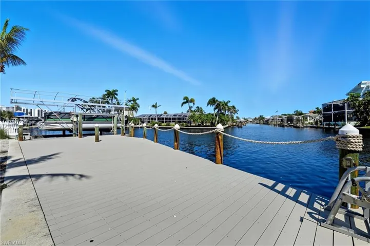 Dock area featuring a water view - Virtually Edited Image