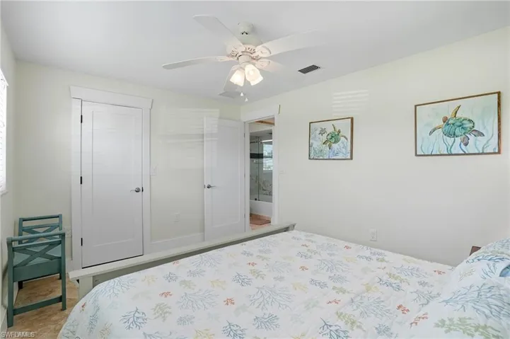 Bedroom featuring a ceiling fan and a closet - Virtually Edited Image
