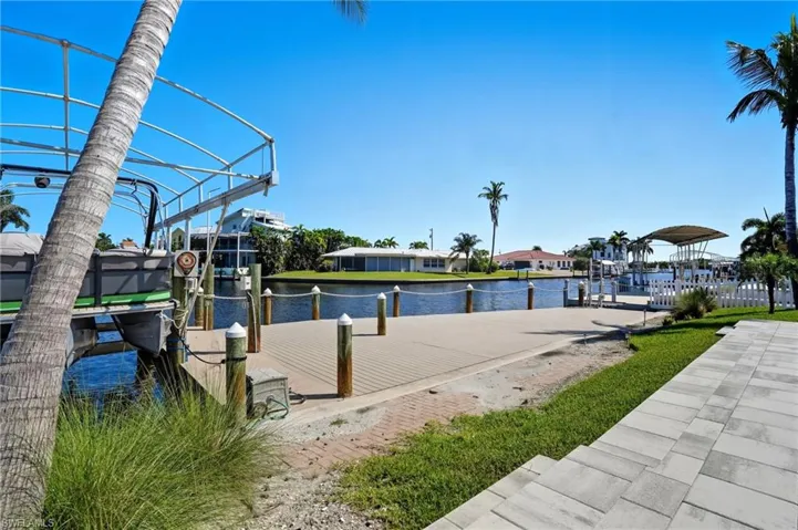 Dock with boat lift and a water view - Virtually Edited Image