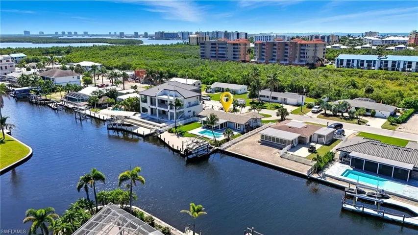 Drone / aerial view of a nearby body of water and city skyline - Virtually Edited Image