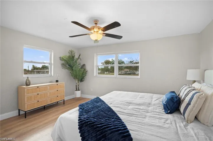 Bright interior space featuring wood-finish flooring and light-toned walls