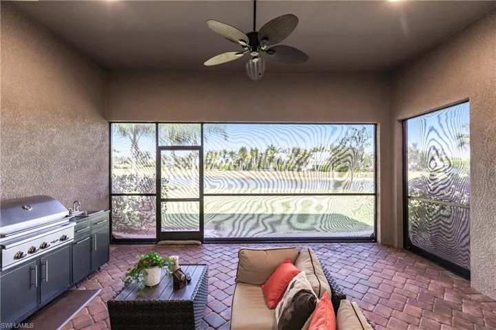 Sunroom / solarium with sink and ceiling fan