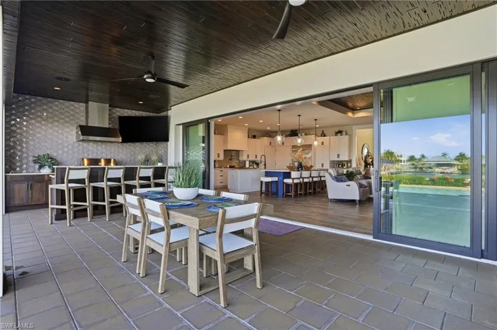 Dining area featuring a cypress wood ceilings and outdoor kitchen