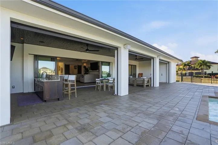 View of patio / terrace featuring a ceiling fan, outdoor dining area, and an outdoor hangout area