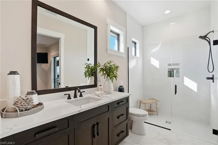 Bathroom featuring vanity and a walk in shower