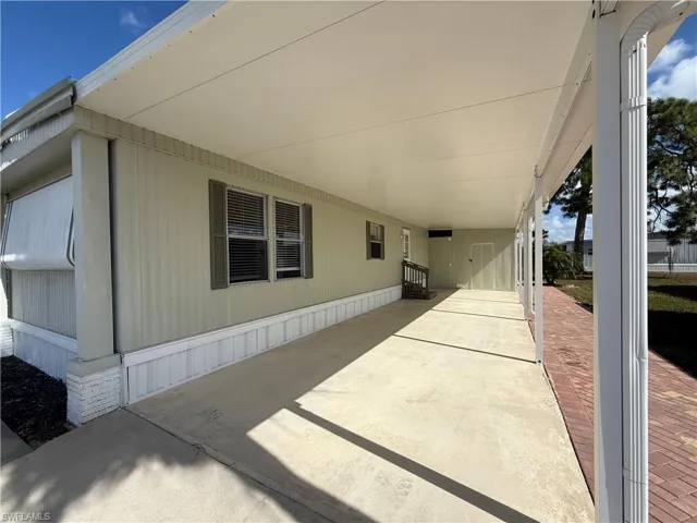 View of patio featuring a carport