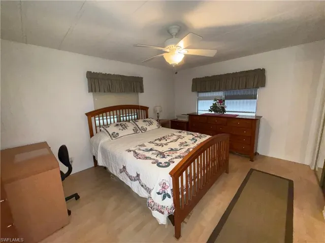 Bedroom with light wood-style flooring and ceiling fan