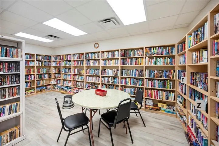 Sitting room with bookshelves and a drop ceiling