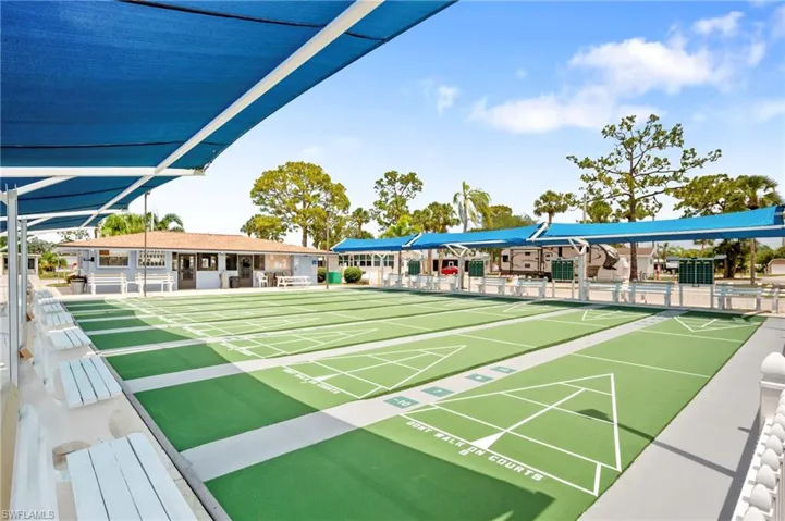 View of home's community with shuffleboard