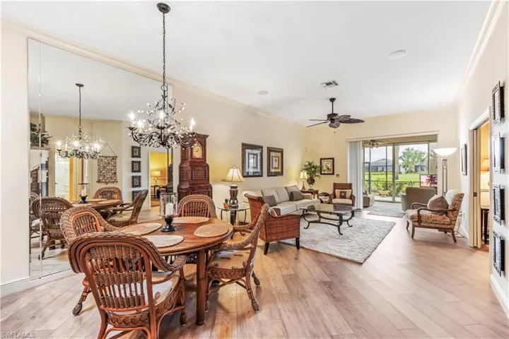 Dining Room Open to Living Room, Florida Room and Screened in Lanai Overlooking the Golf Course