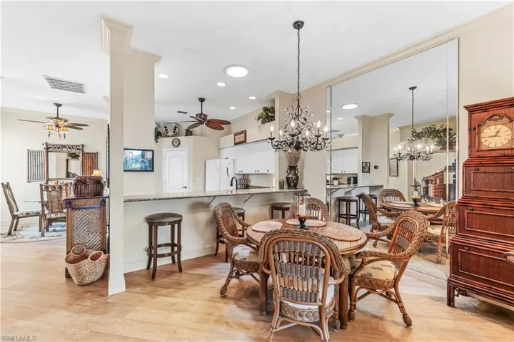 Breakfast Room, Dining Room & Kitchen. Notice the Beautiful wood like floors