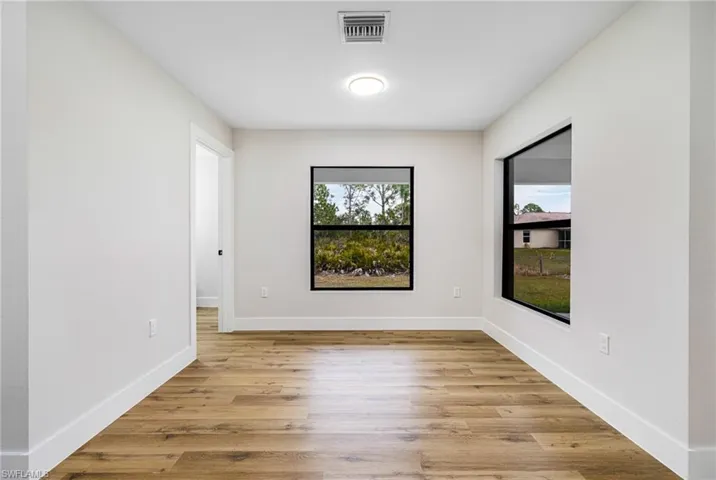 Empty room featuring light wood-style flooring