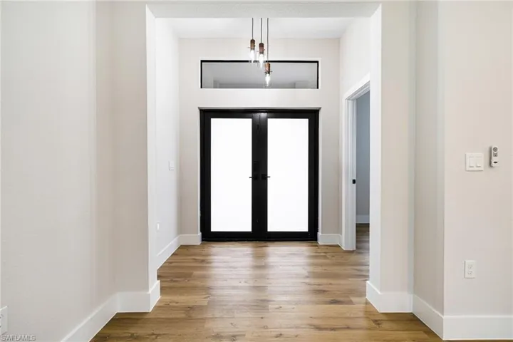 Entryway featuring light wood-style floors and baseboards