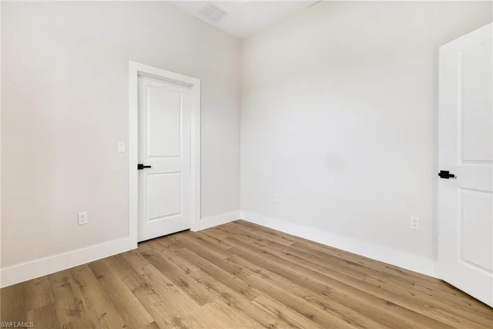 Empty room featuring light wood-style flooring and baseboards