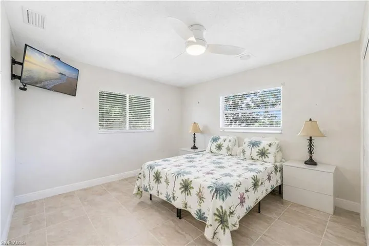 Bedroom featuring ceiling fan and light tile patterned floors