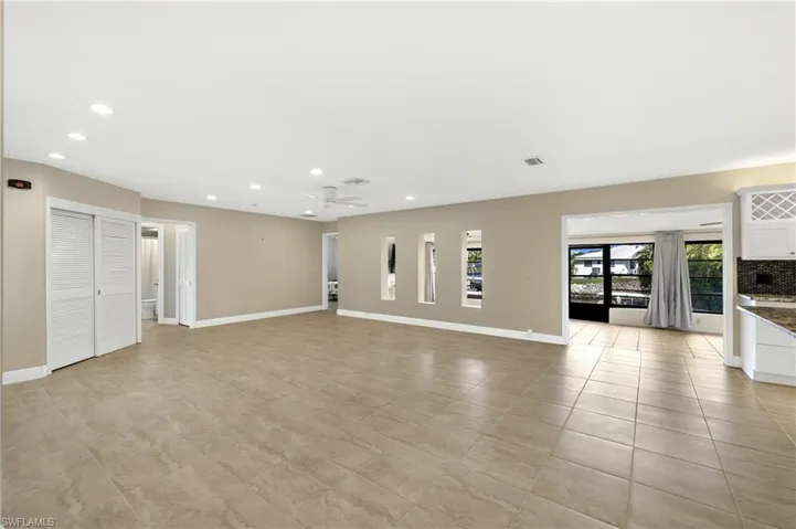 Unfurnished living room featuring light tile patterned floors