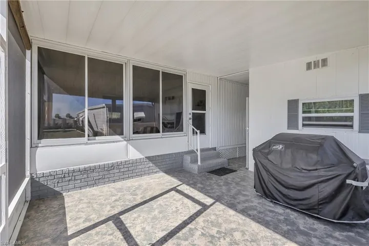 View of patio / terrace featuring area for grilling and entry steps